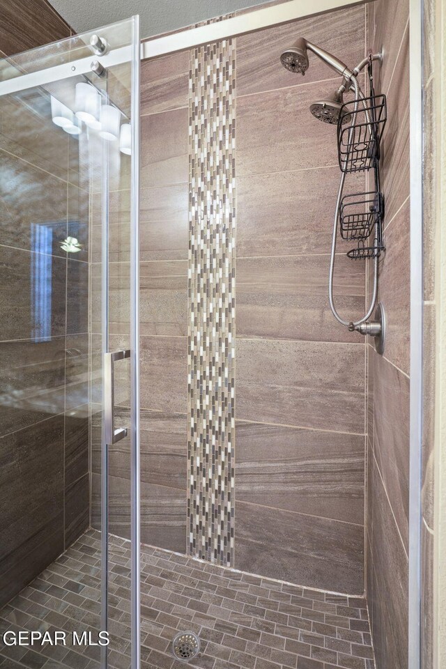 7722 Enchanted Ridge Dr, El Paso, TX 79911 - bathroom featuring a stall shower