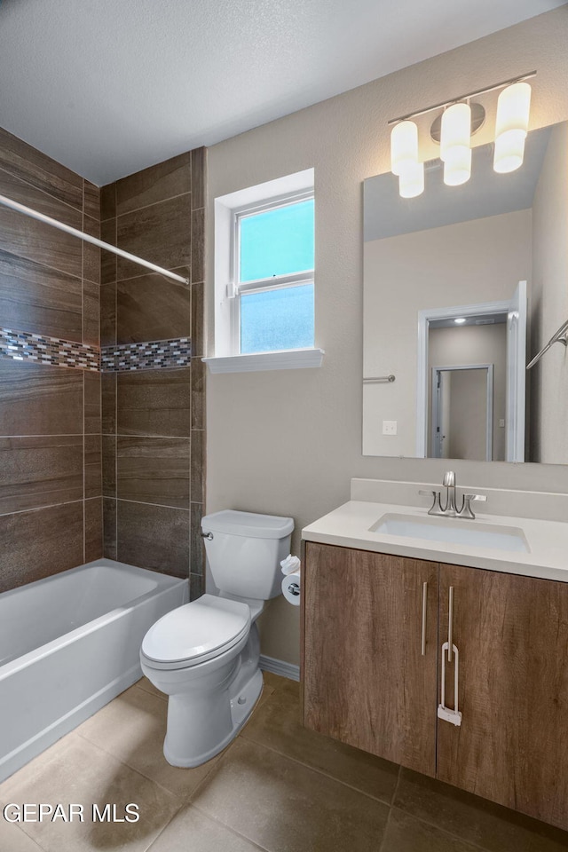 7722 Enchanted Ridge Dr, El Paso, TX 79911 - bathroom featuring tile patterned floors, vanity, and shower / bathtub combination