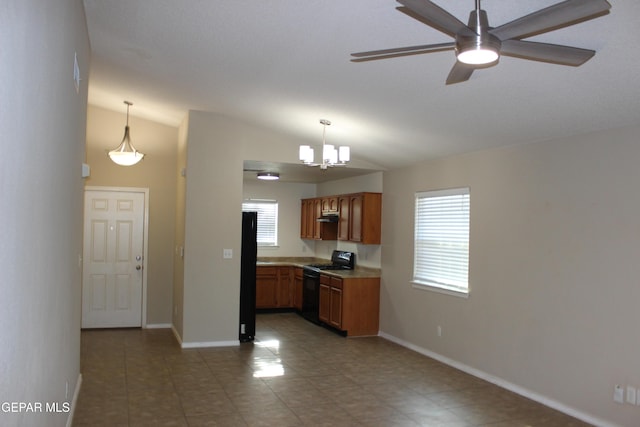 13978 Vaquero Rock Dr, El Paso, TX 79938 - kitchen with black gas stove, fridge, lofted ceiling, brown cabinetry, and a ceiling fan