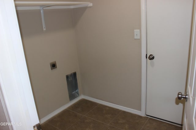 13978 Vaquero Rock Dr, El Paso, TX 79938 - washroom featuring electric dryer hookup and dark tile patterned flooring