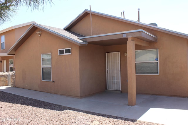 13978 Vaquero Rock Dr, El Paso, TX 79938 - entrance to property featuring stucco siding and a patio area