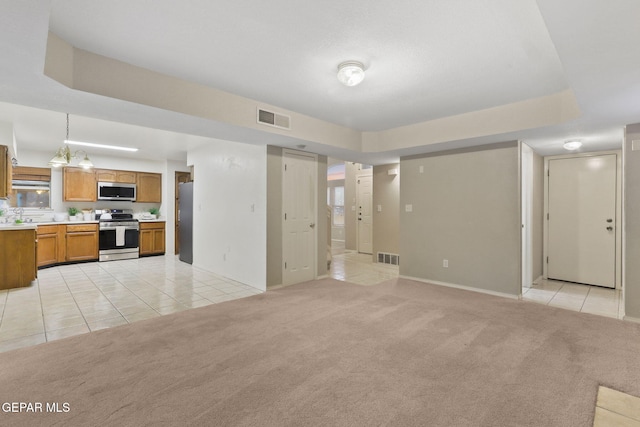 6736 Dakota Ridge Dr, El Paso, TX 79912 - unfurnished living room with light tile patterned floors, light carpet, and a raised ceiling