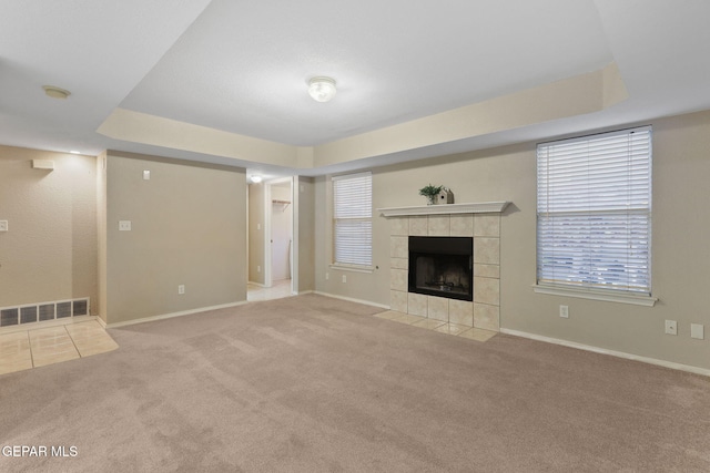 6736 Dakota Ridge Dr, El Paso, TX 79912 - unfurnished living room featuring carpet floors and a tiled fireplace