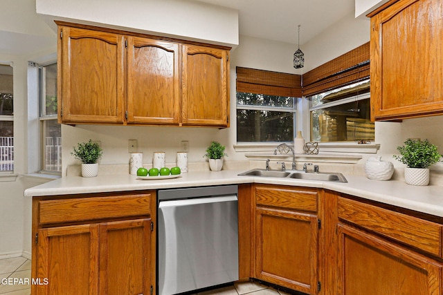 6736 Dakota Ridge Dr, El Paso, TX 79912 - kitchen with dishwasher, light tile patterned flooring, light countertops, and brown cabinetry