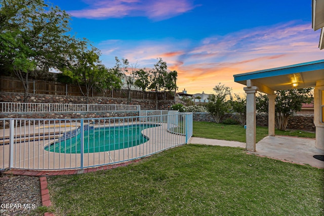 6736 Dakota Ridge Dr, El Paso, TX 79912 - pool at dusk featuring a fenced backyard and a patio