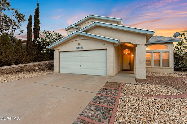 6736 Dakota Ridge Dr, El Paso, TX 79912 - view of front of property featuring stucco siding, concrete driveway, and a garage