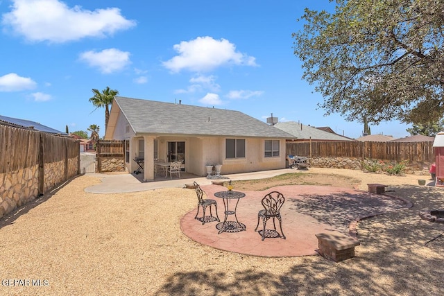 3280 Fawn Passage Place, El Paso, TX 79936 - back of property featuring a fenced backyard, a patio, and roof with shingles