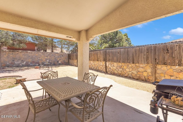 3280 Fawn Passage Place, El Paso, TX 79936 - fenced backyard with a patio and outdoor dining area