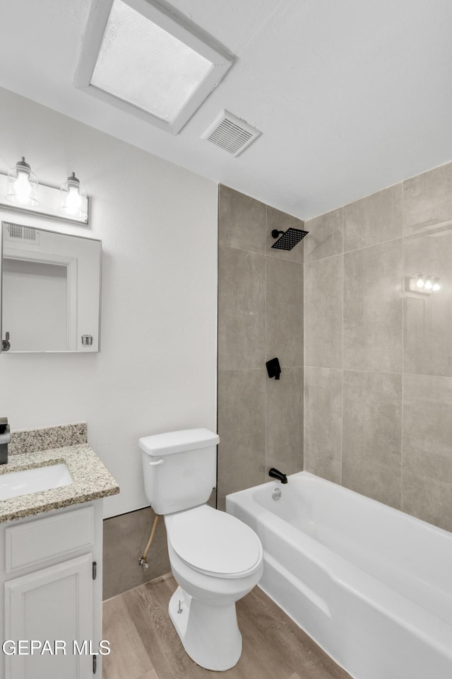 231 Romeria Dr, El Paso, TX 79907 - full bath with vanity, wood finished floors, and shower / bath combination