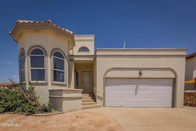 3148 Tierra Encino Dr, El Paso, TX 79938 - view of front of property featuring stucco siding, driveway, and a garage