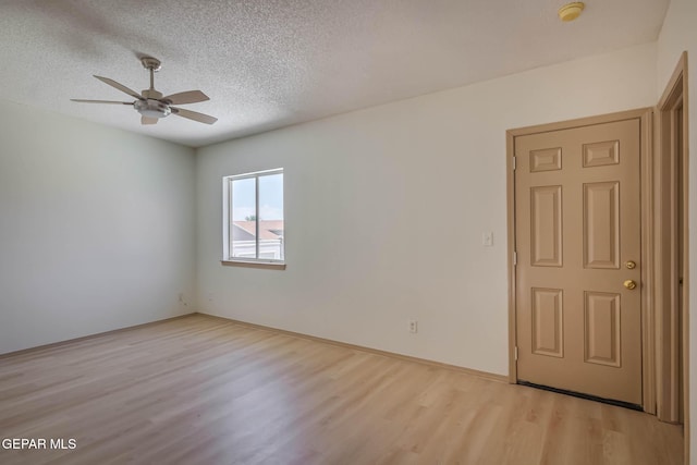 3148 Tierra Encino Dr, El Paso, TX 79938 - spare room with light wood finished floors, a textured ceiling, a smoke detector, and a ceiling fan