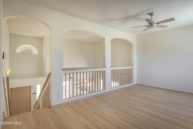 3148 Tierra Encino Dr, El Paso, TX 79938 - unfurnished room with ceiling fan, wood finished floors, a textured ceiling, and healthy amount of natural light