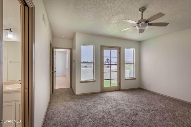 3148 Tierra Encino Dr, El Paso, TX 79938 - empty room with carpet floors, ceiling fan, and a textured ceiling
