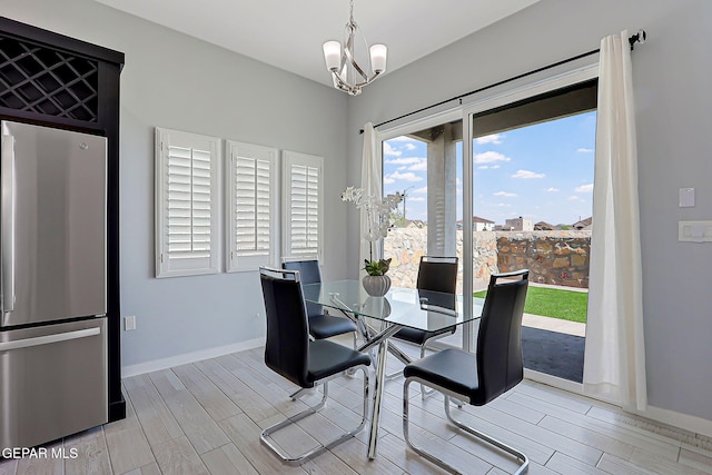 13860 Summer View Ave, El Paso, TX 79928 - dining room with wood tiled floors and a chandelier