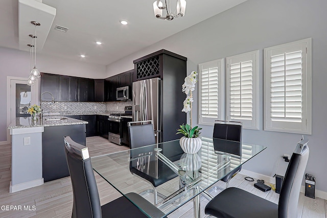 13860 Summer View Ave, El Paso, TX 79928 - dining room featuring light wood-style floors, recessed lighting, and a chandelier