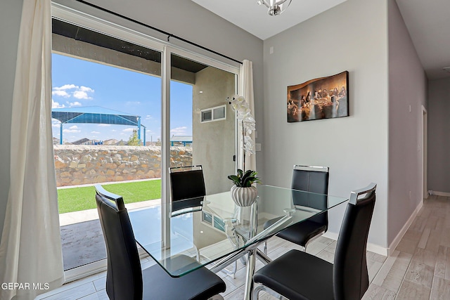 13860 Summer View Ave, El Paso, TX 79928 - dining space with light wood finished floors and baseboards