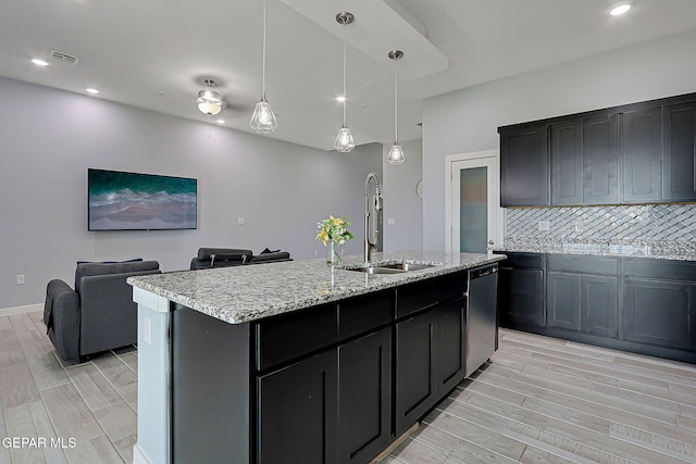 13860 Summer View Ave, El Paso, TX 79928 - kitchen featuring wood finish floors, dishwasher, open floor plan, a center island with sink, and pendant lighting