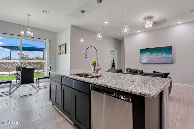 13860 Summer View Ave, El Paso, TX 79928 - kitchen featuring stainless steel dishwasher, light wood-type flooring, light stone countertops, a center island with sink, and recessed lighting