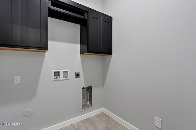 13860 Summer View Ave, El Paso, TX 79928 - laundry area with hookup for a gas dryer, washer hookup, electric dryer hookup, cabinet space, and light wood-type flooring