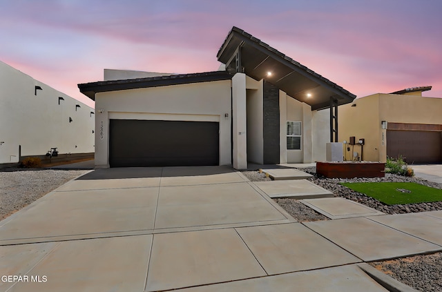 13860 Summer View Ave, El Paso, TX 79928 - modern home featuring driveway, an attached garage, and stucco siding