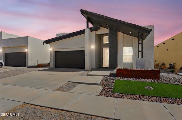 13860 Summer View Ave, El Paso, TX 79928 - contemporary house with concrete driveway, a garage, and stucco siding