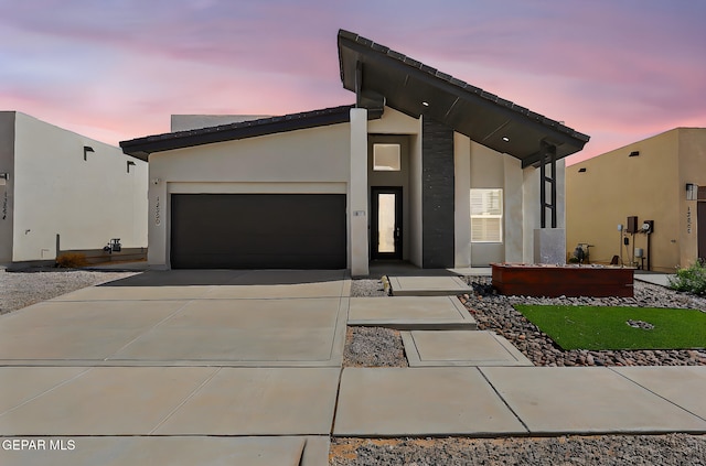 13860 Summer View Ave, El Paso, TX 79928 - contemporary home with driveway, a garage, and stucco siding