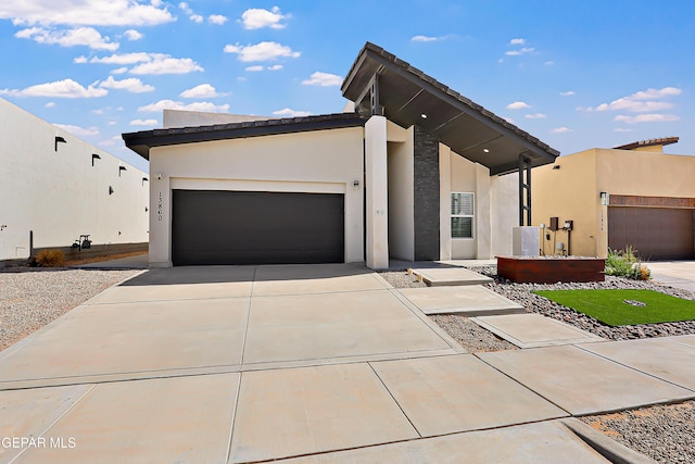 13860 Summer View Ave, El Paso, TX 79928 - view of front of house with stucco siding, driveway, and a garage