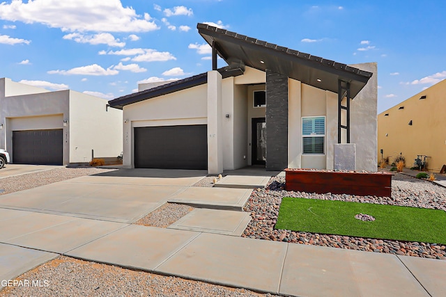13860 Summer View Ave, El Paso, TX 79928 - contemporary home featuring driveway, stucco siding, and a garage