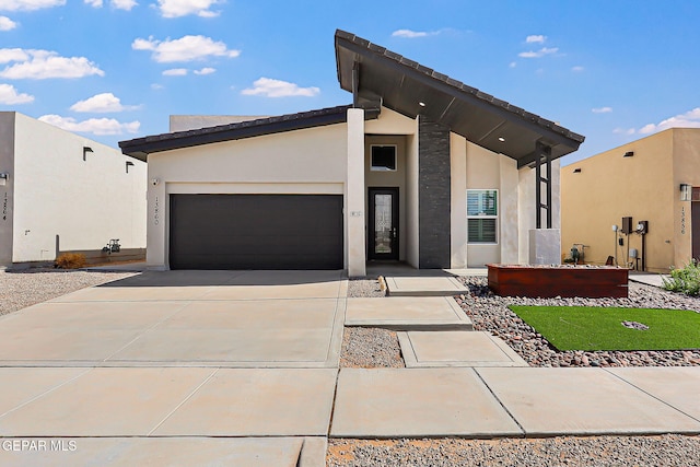 13860 Summer View Ave, El Paso, TX 79928 - view of front of house with concrete driveway, a garage, and stucco siding