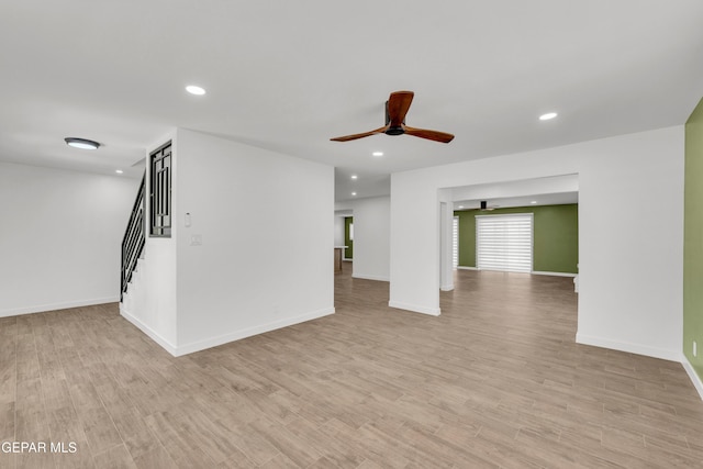 10229 Luella Ave, El Paso, TX 79925 - unfurnished living room with ceiling fan, recessed lighting, light wood-style flooring, and stairs