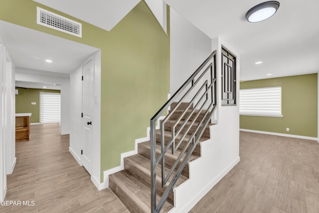 10229 Luella Ave, El Paso, TX 79925 - stairway with wood finished floors and recessed lighting