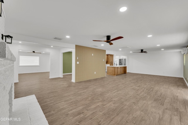 10229 Luella Ave, El Paso, TX 79925 - unfurnished living room with a ceiling fan, light wood finished floors, recessed lighting, and a brick fireplace