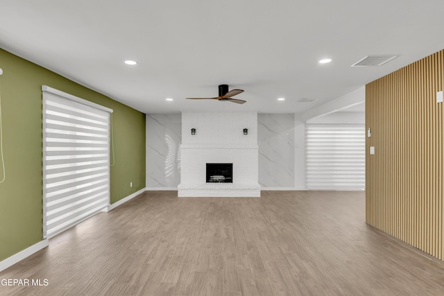 10229 Luella Ave, El Paso, TX 79925 - unfurnished living room with ceiling fan, a fireplace, wood finished floors, and recessed lighting