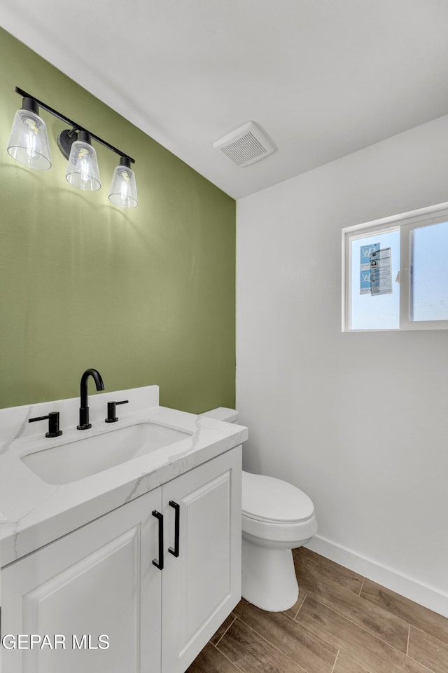 10229 Luella Ave, El Paso, TX 79925 - bathroom with wood finished floors and vanity