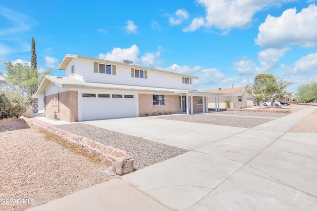 10229 Luella Ave, El Paso, TX 79925 - traditional home featuring a porch, driveway, brick siding, and an attached garage
