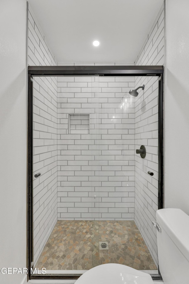 10229 Luella Ave, El Paso, TX 79925 - bathroom with a shower stall and recessed lighting
