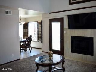 13643 Pecos River Rd, Clint, TX 79836 - living room with a tile fireplace and a chandelier