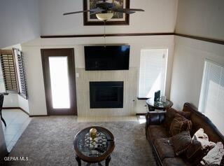 13643 Pecos River Rd, Clint, TX 79836 - carpeted living room featuring a glass covered fireplace