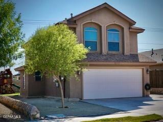 13643 Pecos River Rd, Clint, TX 79836 - view of front of property featuring concrete driveway, stucco siding, and a garage