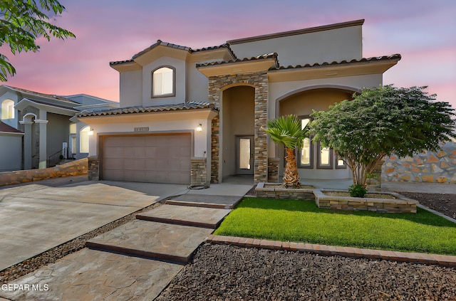 12511 Furlong Cir, El Paso, TX 79928 - mediterranean / spanish-style home featuring stucco siding, stone siding, driveway, and a tiled roof