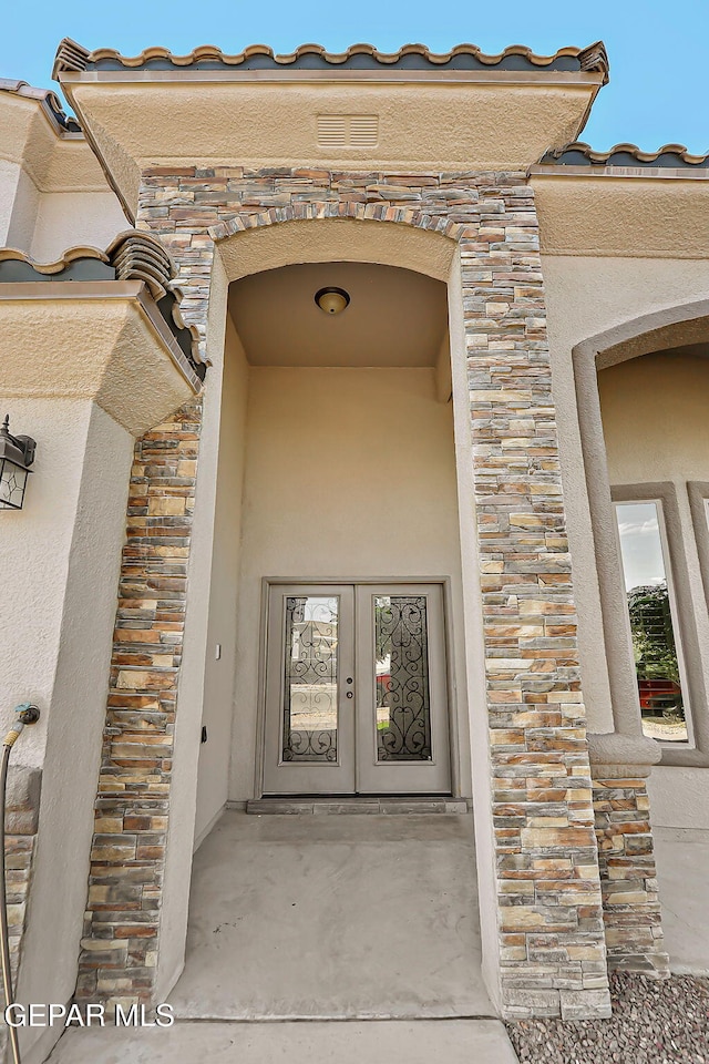 12511 Furlong Cir, El Paso, TX 79928 - entrance to property featuring stone siding, french doors, and stucco siding