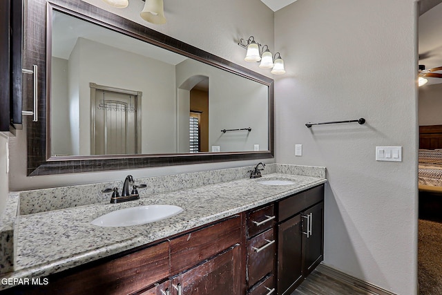 12511 Furlong Cir, El Paso, TX 79928 - full bathroom featuring double vanity and wood finished floors
