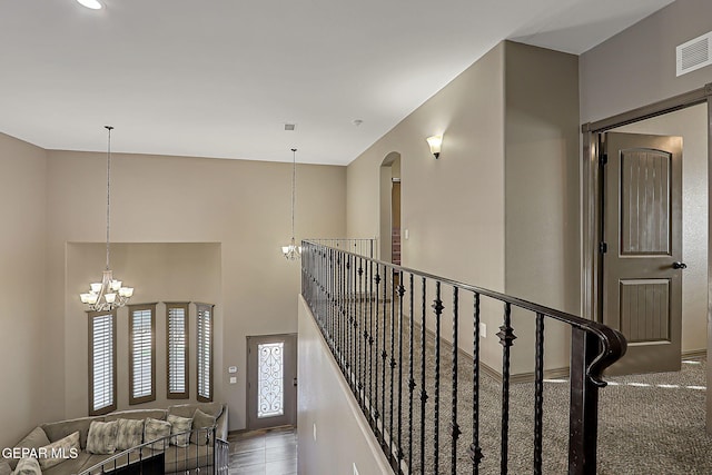 12511 Furlong Cir, El Paso, TX 79928 - stairway with a chandelier and arched walkways