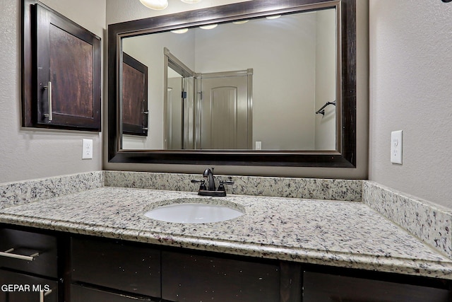 12511 Furlong Cir, El Paso, TX 79928 - bathroom featuring vanity and a textured wall