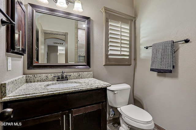12511 Furlong Cir, El Paso, TX 79928 - half bathroom featuring vanity and toilet