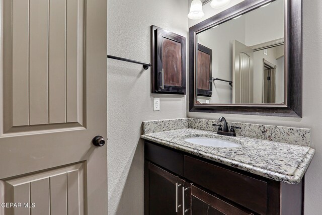12511 Furlong Cir, El Paso, TX 79928 - bathroom with vanity and a textured wall
