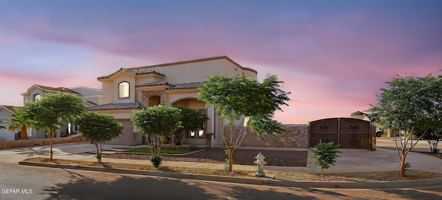 12511 Furlong Cir, El Paso, TX 79928 - view of front facade with concrete driveway, a gate, a garage, and stucco siding