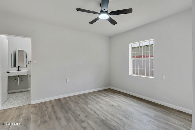 209 Hardesty Pl, El Paso, TX 79905 - unfurnished bedroom featuring wood finished floors and a ceiling fan