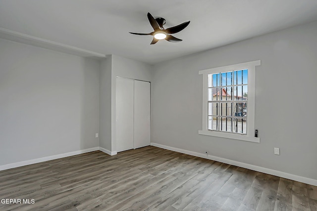 209 Hardesty Pl, El Paso, TX 79905 - unfurnished bedroom with wood finished floors, a closet, and a ceiling fan