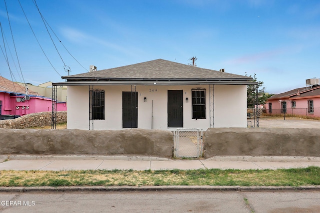 209 Hardesty Pl, El Paso, TX 79905 - view of front facade with a fenced front yard, a gate, roof with shingles, and a porch